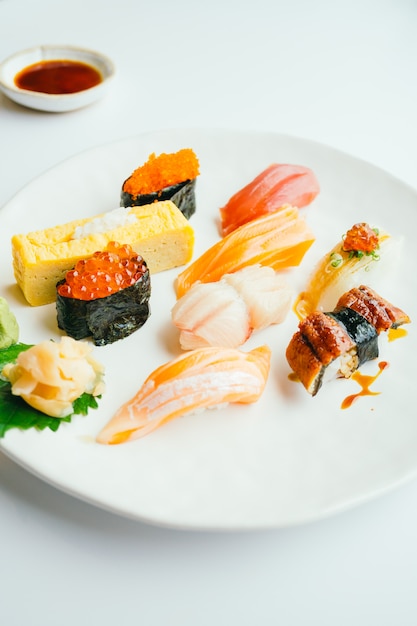 Raw and fresh nigiri sushi set in white plate