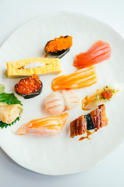 Raw and fresh nigiri sushi set in white plate