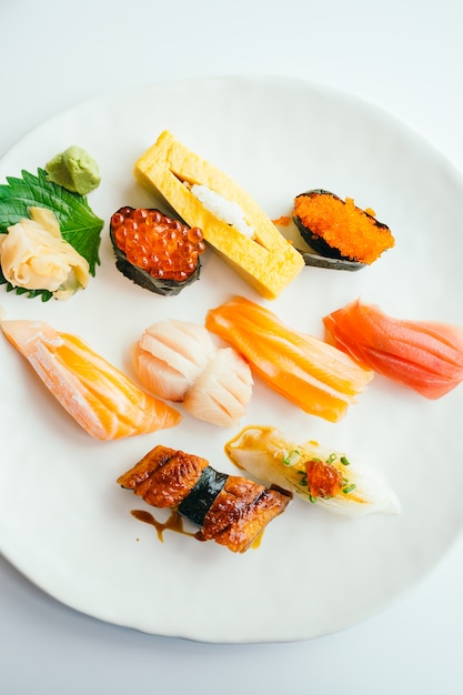 Raw and fresh nigiri sushi set in white plate