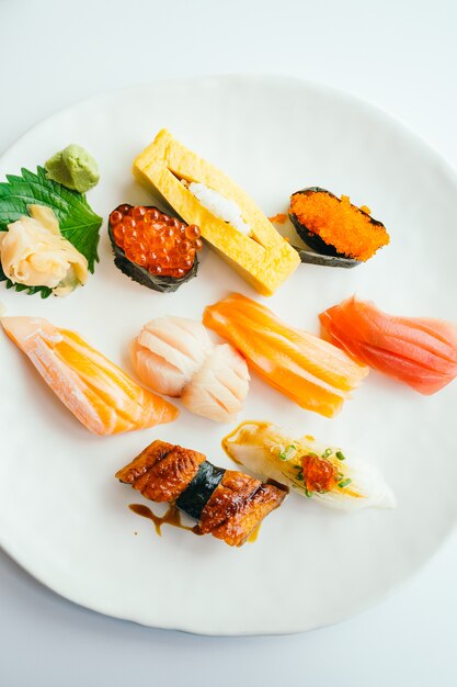 Raw and fresh nigiri sushi set in white plate