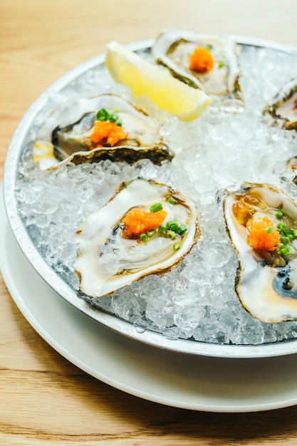 Raw and fresh oyster shell with lemon