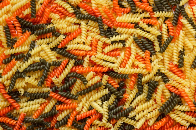 Raw fusilli pasta close-up. horizontal