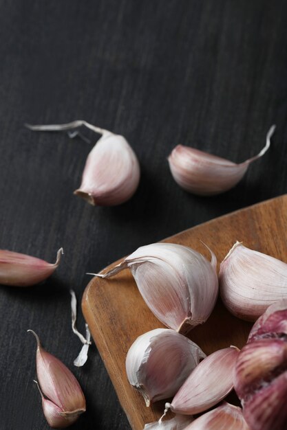 Raw garlic on cutting board