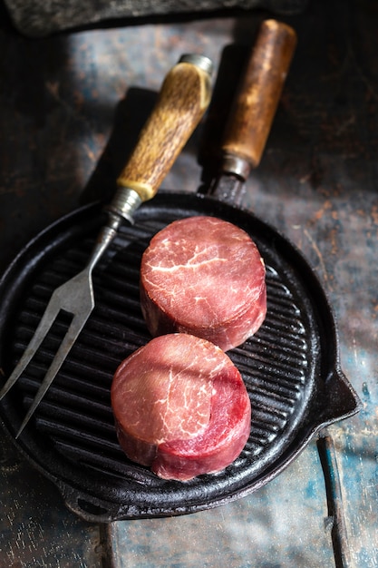 Raw meat on plate arrangement