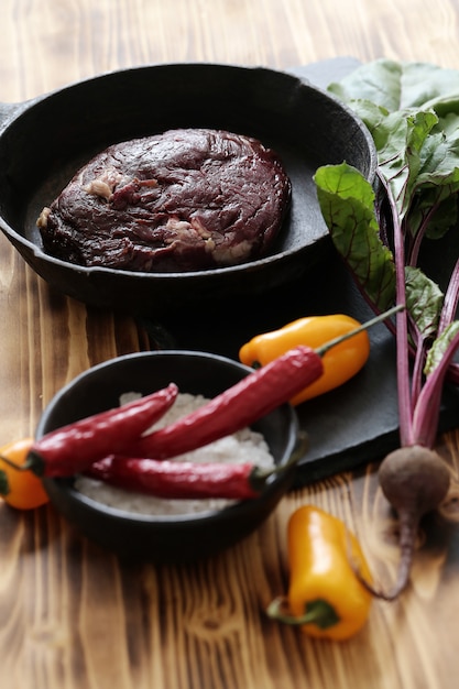 Raw meat with ingredients for cooking meal