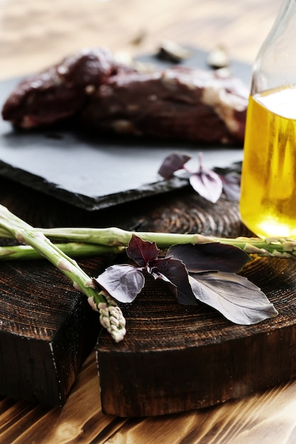 Raw meat with ingredients for cooking meal