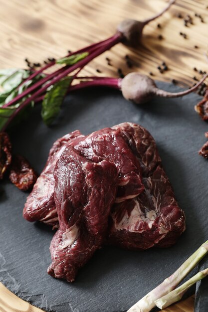 Raw meat with ingredients for cooking meal