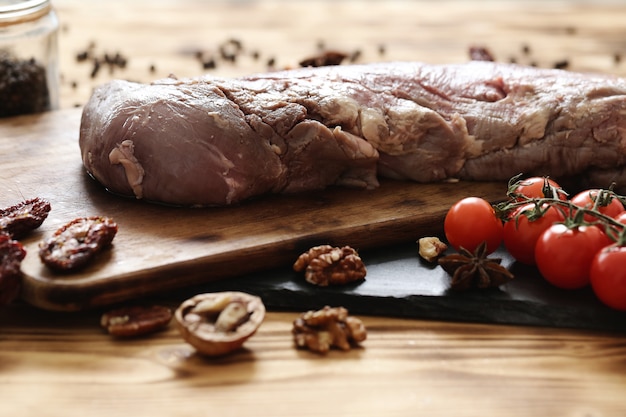 Free photo raw meat with ingredients for cooking meal