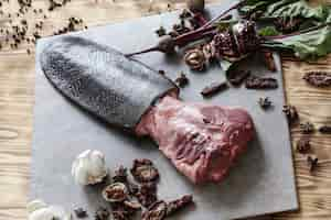 Free photo raw meat with ingredients for cooking meal