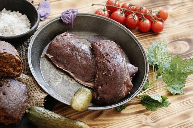 Raw meat with ingredients for cooking meal