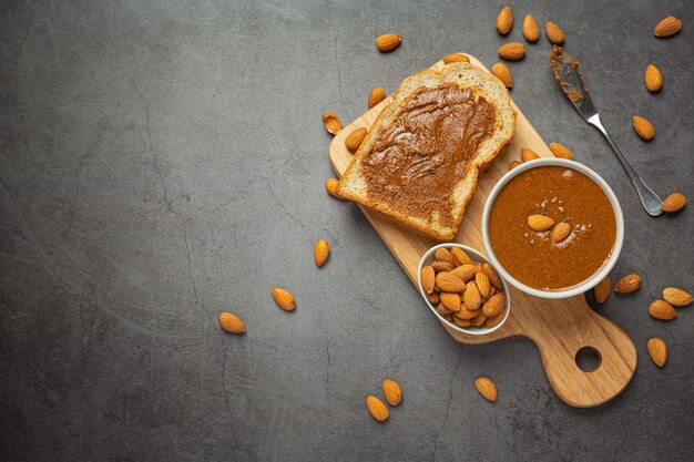 Raw Organic Almond Butter on dark background