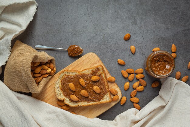 Raw Organic Almond Butter on dark background