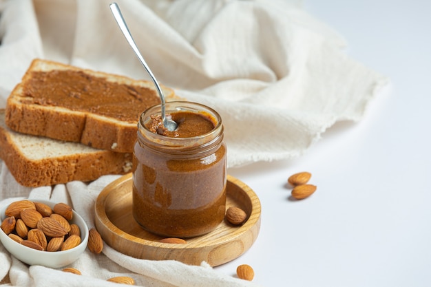 Raw Organic Almond Butter on white background