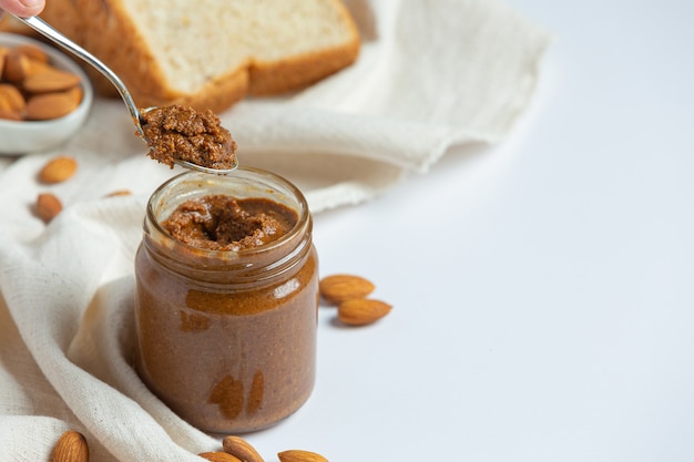 Raw Organic Almond Butter on white background