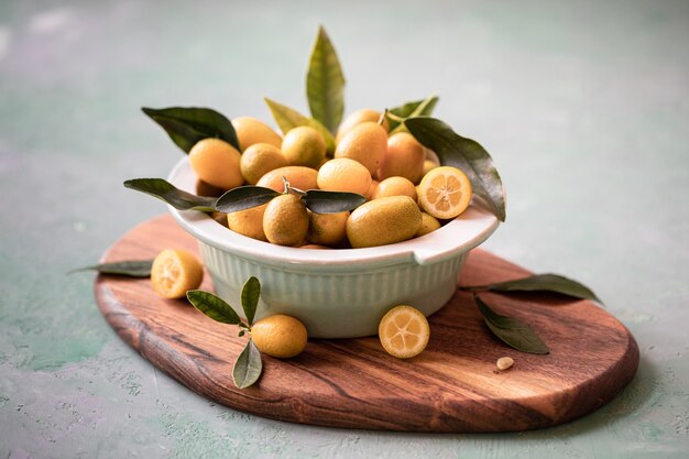 Raw Organic Orange Kumquats in a Bowl