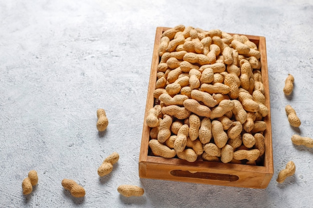 Raw organic peanuts in shell.