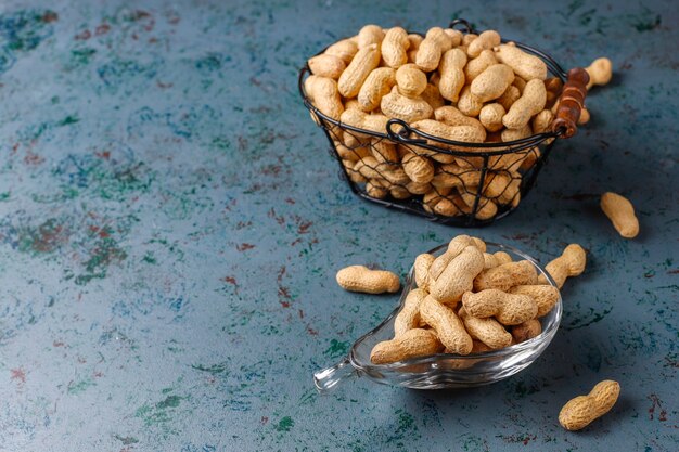 Raw organic peanuts in shell.