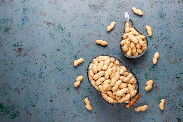 Raw organic peanuts in shell.