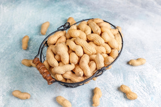 Raw organic peanuts in shell.