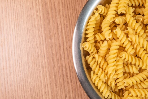 Raw pasta in bowl - macro detail
