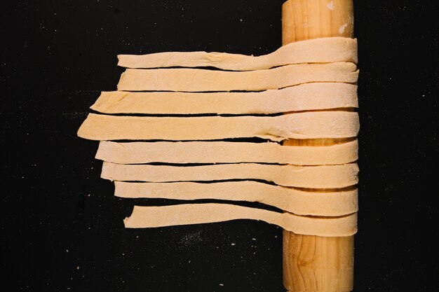 Raw pasta on rolling pin