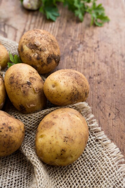 Raw potatoes on canvas sack