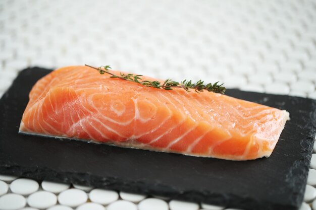 Raw salmon with pink salt and rosemary