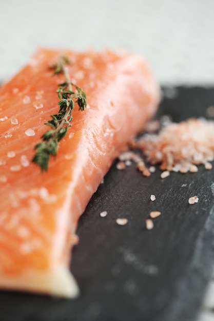 Raw salmon with pink salt and rosemary