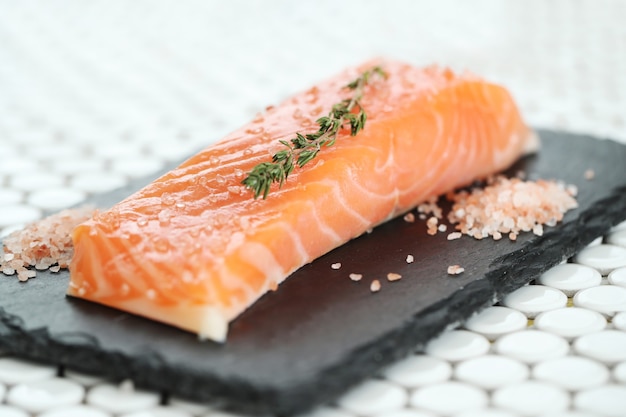 Raw salmon with pink salt and rosemary