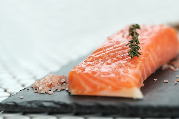 Raw salmon with pink salt and rosemary