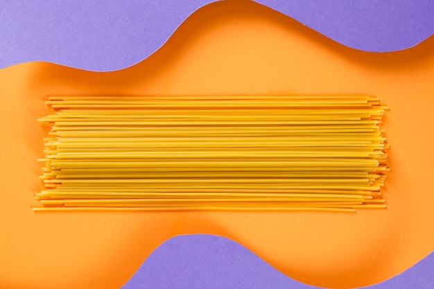 Raw spaghetti with wavy background