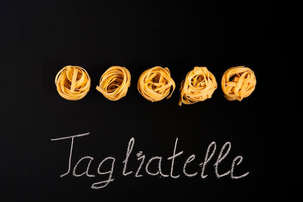 Free photo raw tagliatelle pasta