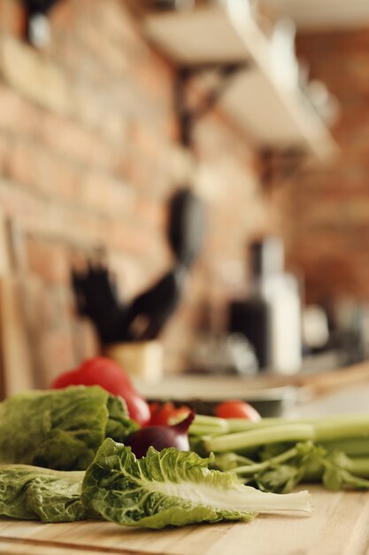 Raw vegetables on wooden board