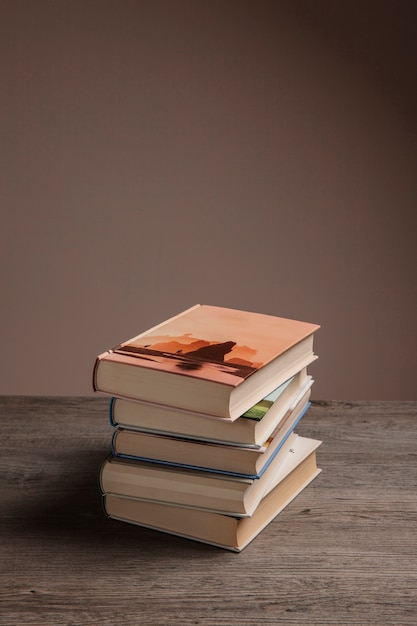 Free photo reading concept with pile of books