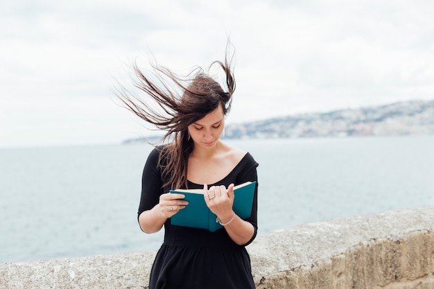 Free photo reading on a windy day