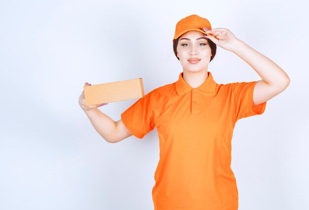 READY TO WORK. woman in orange unishape ready to deliver