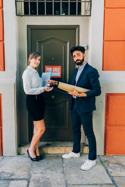 Free photo real estate agents showing a house