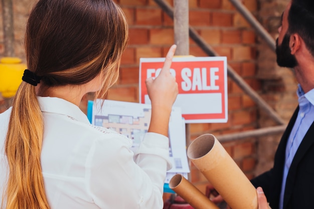 Real estate agents visiting the construction