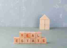 Free photo real estate concept with wooden blocks with words