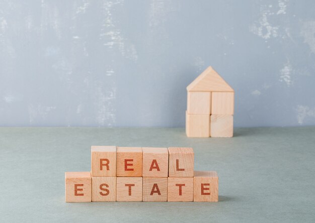 Real estate concept with wooden blocks with words