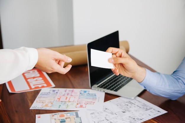 Real estate workers with business card