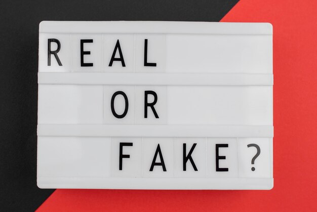 Real or fake news concept flat lay