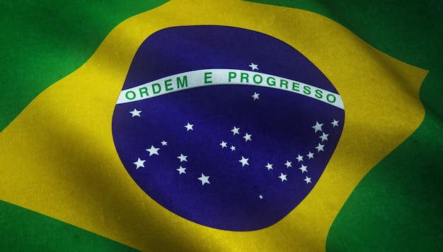興味深いテクスチャを持つブラジルの旗を振ってのリアルなショット