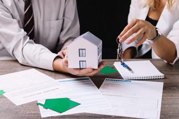 Realtor giving keys to new owner