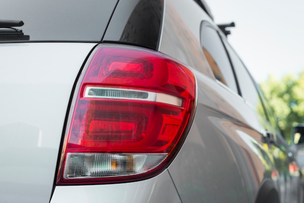 Rear light on new silver automobile