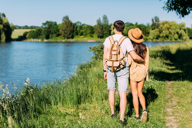 Rear view of couple looking at scenics lake