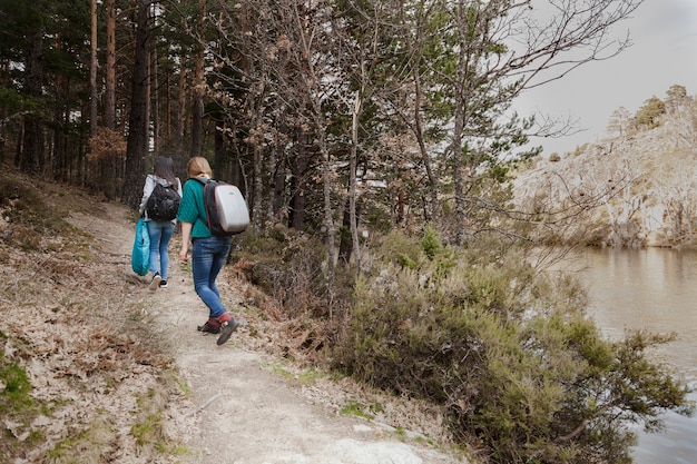 Rear view of girls walking in the countryside