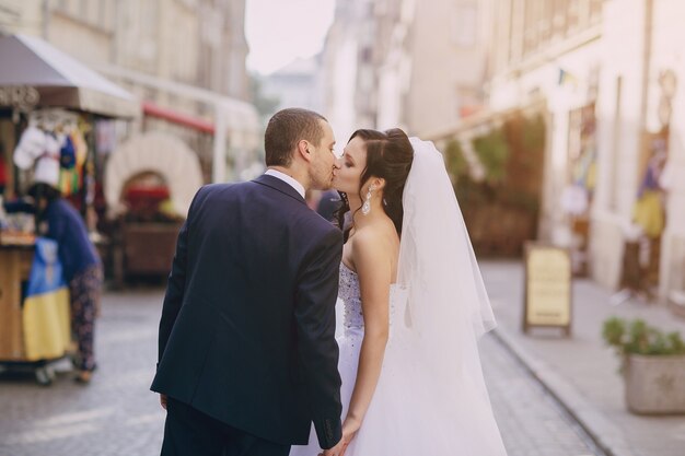 Rear view of newlyweds giving a kiss