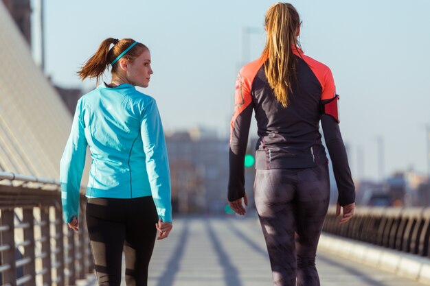 Rear view of sportswomen walking