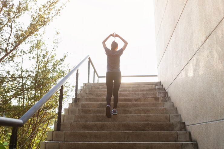 Free Photo rear view of sporty woman on stairs